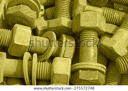 bolts and nuts stacked together, closeup of photo