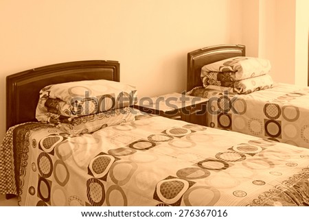bedding and bed in the room, closeup of photo