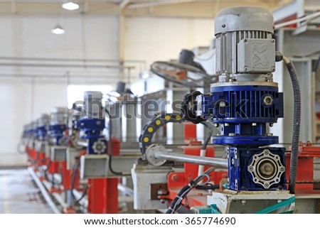ceramic production machinery and equipment in a factory, closeup of photo