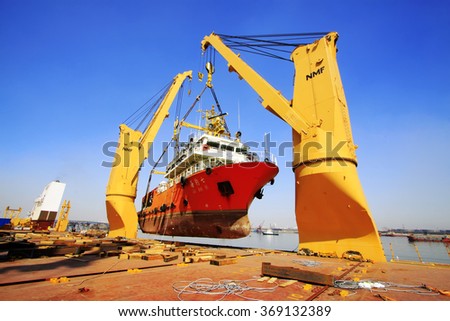 TIANJIN PORT - MARCH 23: seal 7 Exploration ship was hoisted in a large cargo ship, on March 23, 2015, tianjin port, tianjin, China.