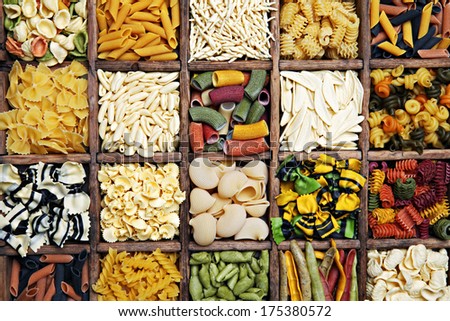 Various italian pasta in the wooden box.