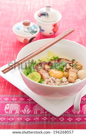 Sukhothai noodle soup in Thailand, On red table linen elephant texture (Noodle, Thai Noodle, Thailand Food)