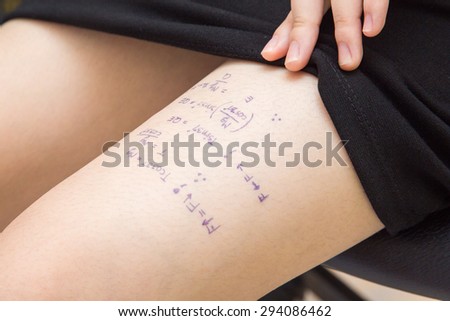 student cheat on exams by writing equation words on the legs.