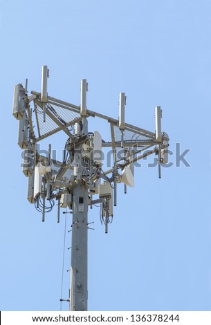 Antennas and electronic communications equipment on top of a tower form part of a cellular network.