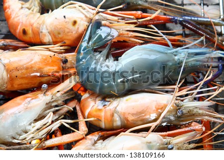fresh prawn among grilled prawns