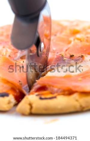 Smoked salmon pizza with pizza cutter