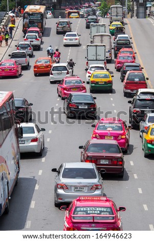BANGKOK, THAILAND - AUGUST 06, 2013: Very bad traffic in the center of Bangkok city. The number of vehicle in Bangkok rose to 7.5 million but the city can only accommodate 1.6 million vehicles.