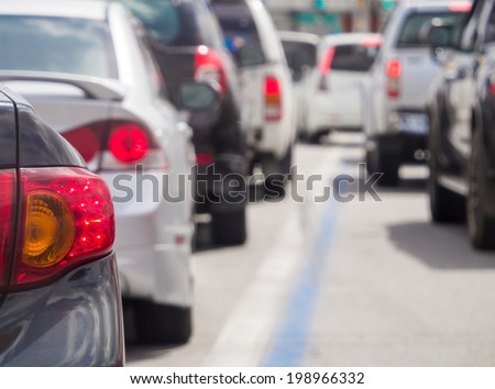 Car queue in the bad traffic road. Selective focus.