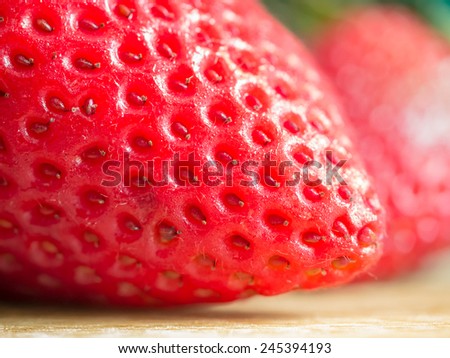 Macro shot of strawberry tip showing the seeds