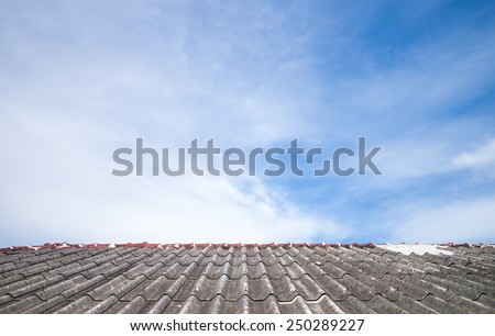 Cloudy sky over the asbestos roof tiles able to use as background