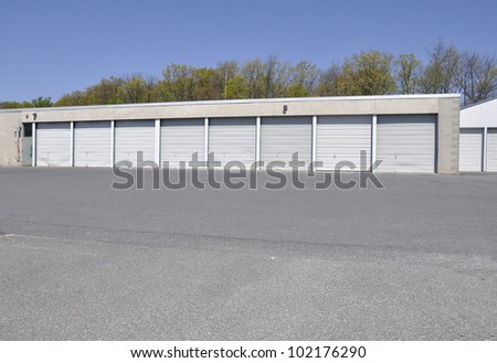 building with many garage doors, which are all closed;