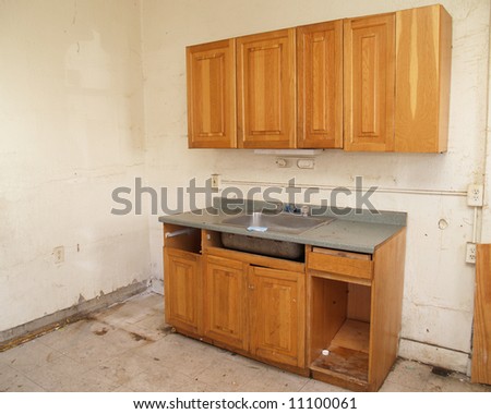 an outdated kitchen in need of repair and remodeling