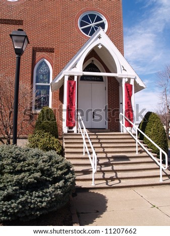 doors and steps entry to a red brick church