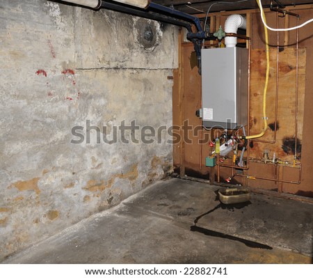 furnace heating unit on wall in an old basement