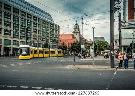 BERLIN, SEPTEMBER 8, 2013: Yellow tram on city street on October 8, 2013 in Berlin, Germany.
