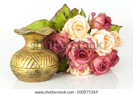 Old vase and flower on white background,rose