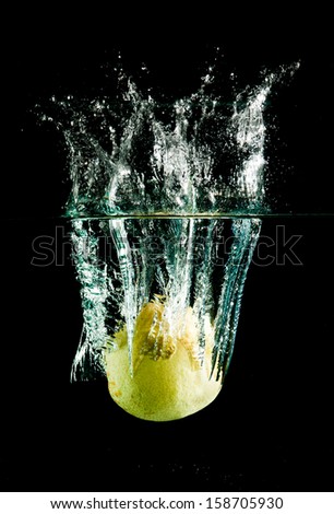 oriental pear in water on a black background.