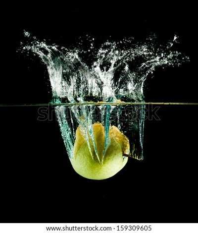 oriental pear in water on a black background.
