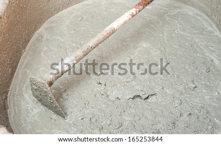 spade and wet cement image for construction process