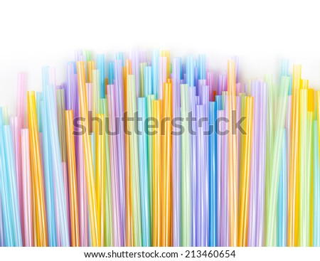 Drinking straw colorful plastic tubes over white as abstract background