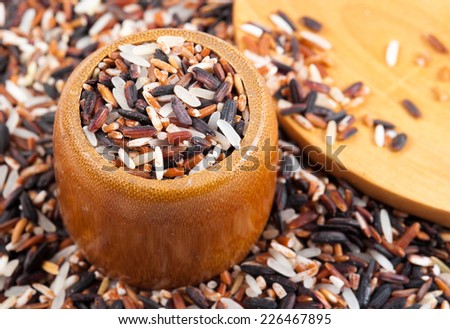 Food background with of rice variety . rice mixture. brown rice, black rice, white rice.