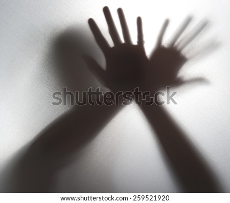 Silhouette of a hand in the back light,blur image