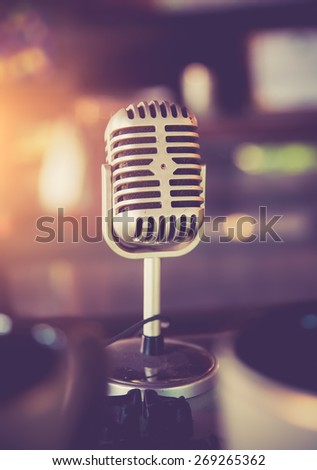 Retro styled microphone,vintage color toned image
