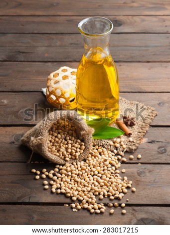 Soy bean and soy oil on wooden,Selective focus with shallow depth of field.