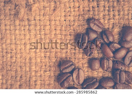 coffee beans on canvas,Selective focus  coffee beans,vintage color toned image