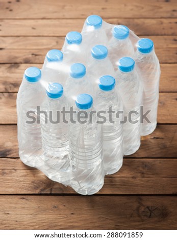 packed bottled water on wood