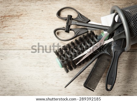 hairdresser tools on white wood
