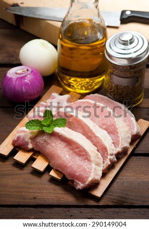 Meat, pork, slices pork loin on wood