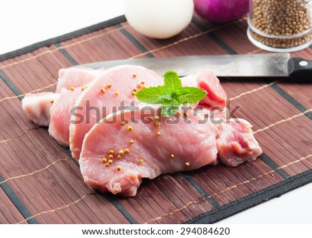 Meat, pork, slices pork loin on wood