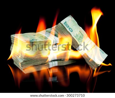 Thai money bill on fire with black background