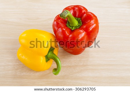 yellow sweet pepper on wood background.
