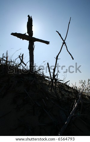 A silhouette of two crosses made out of sticks