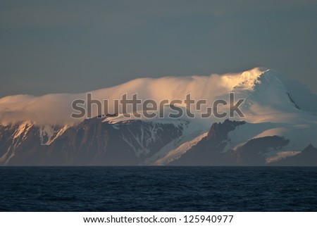 Later afternoon sunlight highlights mountains in the South Shetland Islands.  This is near where Ernest Shackelton and his crew wrecked their ship.