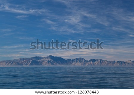False Bay, near Cape Town in South Africa, is surrounded by dramatic mountains that fall steeply to the sea.  False Bay is known for its large population of Great White sharks.