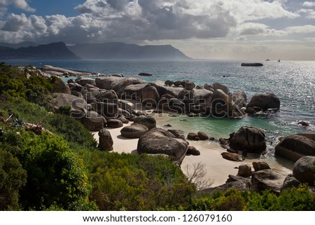 The rocky coastline of False Bay near Table Mountain National Park in South Africa is pleasing.  The bay is massive and known for its Great White shark population.