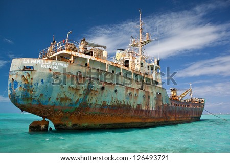 An old cargo ship has run aground in the shallow near the Turks & Caicos Islands.  This shipwreck will eventually turn into a shallow artificial reef.