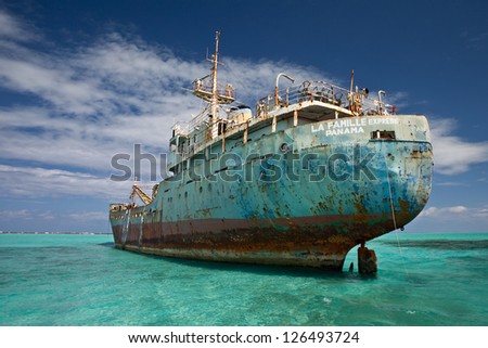 An old cargo ship has run aground in the shallow near the Turks & Caicos Islands.  This shipwreck will eventually turn into a shallow artificial reef.