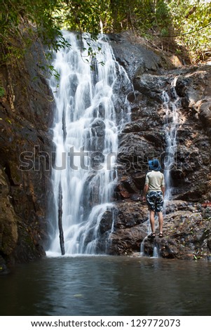 A small waterfall cascades down rocks on a remote island in the Mergui Archipelago in Myanmar.  This set of jungle-covered islands is virtually uninhabited.