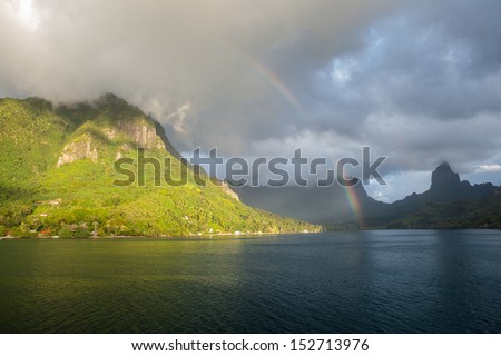 A rainbow appears over the island of Moorea in French Polynesia. This south Pacific tropical island is one of the most beautiful in the world.