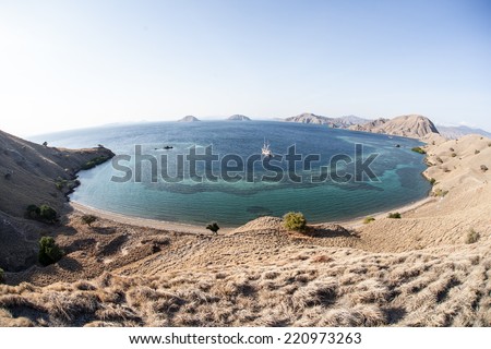 A beautiful bay and coral reef is seen from a vista on a dry island within Komodo National Park, Indonesia. This region is known for its diverse reefs as well as the infamous Komodo dragons.