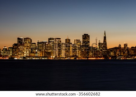 The beautiful skyline of San Francisco is lit by lights during the holiday season. San Francisco is one of America\'s most interesting and iconic cities.