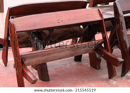Wooden table and bench for garden or in restaurant.