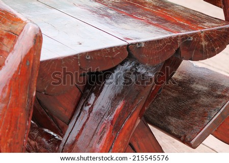 Wooden table and bench for garden or in restaurant.