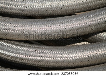 Flexible oil hose with steel wire casing.
