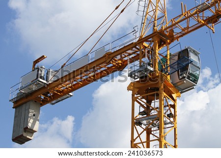 Lifting crane in construction site of concrete bridge.