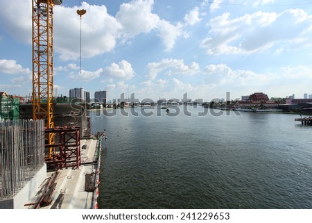 Concrete bridge across Chaophraya river under-construction of its foundation and column.